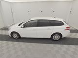 a picture of a white car parked in a garage