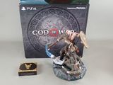 a figurine of a god with a sword on a table