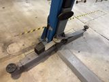 a machine that is sitting on the ground in the garage