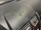 a close up of a car ' s dashboard with a dirty air conditioner