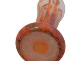 a glass pipe with a red and orange design on it