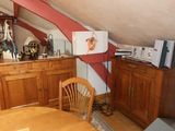 an image of a living room with a tv and a dresser