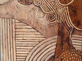a painting of a giraffe that is standing in front of a tree