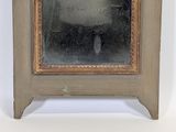 a picture of a mirror with a reflection of a person in it