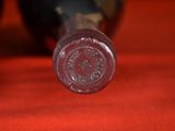 a close up of a bottle of wine on a table