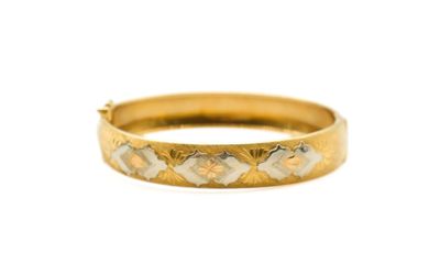 a close up of a gold ring on a white background