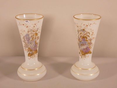 two vases that are sitting on a table
