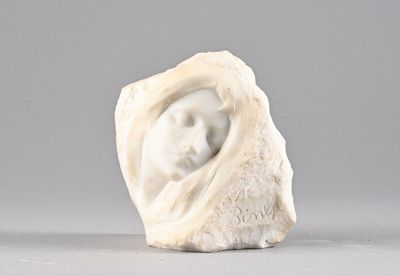 a white sculpture of a woman in a shell on a table