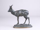 an image of a bronze statue of a gazelle on a white background