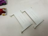 two pieces of plastic that are on a table