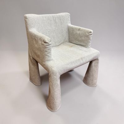 a small chair made out of wool on a white background