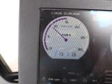 a close up of a car dashboard with a clock on it