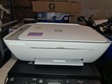 a white printer sitting on top of a black printer