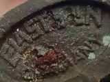 a close up of a rusted metal object on a table