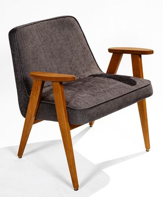 an image of a grey chair with a wooden leg and arm rest