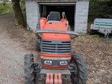 a tractor that is parked in front of a building