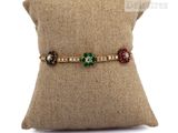 an image of a cushion with a pillow and a bracelet on it