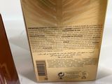 an image of a bottle of liquid sitting next to a box of liquid