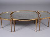 two tables with mirrored tops and gold metal legs