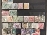 a picture of a collection of stamps on display in a glass case