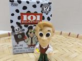 toy figurine of a man with a dog and a box of 101 dalmatian