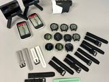 a lot of different watches and gadgets on the table