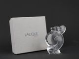 an image of a glass figurine of an elephant in front of a box