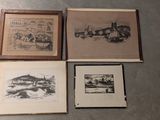 three framed pictures of a city and a river are on the floor