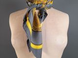 a close up of a mannequin torso with a scarf on it