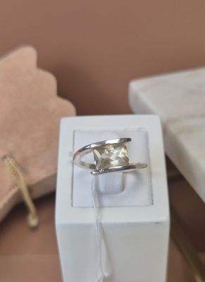 a ring that is sitting in a box on a table