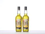 two bottles of alcohol sitting on top of a table