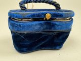 a blue purse that is sitting on a table