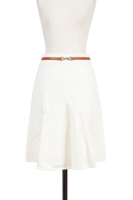 a white dress with a belt on a mannequin mannequin