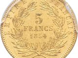 a close up of a gold coin on a white background