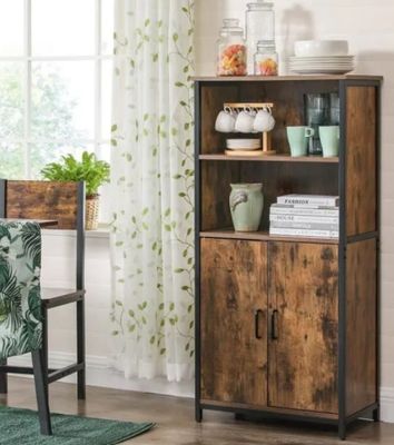 an image of a living room with a bookcase and a chair