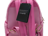 a small pink backpack with a tag on it