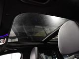 a view of the sunroof from inside of a car