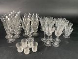 a lot of glasses that are sitting on a table
