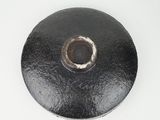 an image of a black metal object on a white surface