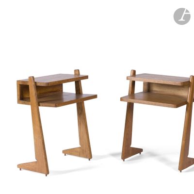 two wooden desks that are sitting next to each other