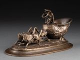 sculpture en bronze représentant un cheval et un chien dans un traîneau