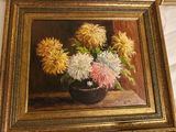 a painting of flowers in a black vase on a table