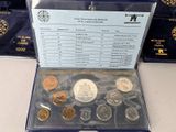 a lot of different coins in a box on the table