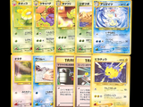 a lot of pokemon cards that are on the table