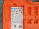 an orange tool case with a sticker on it