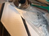 a pair of scissors sitting on top of a piece of paper