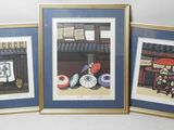 three framed pictures of a street scene with umbrellas and a bench