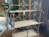 an antique metal shelf with two shelves on top of it