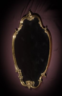 a mirror that is sitting on the wall