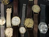 a lot of watches that are sitting on a table